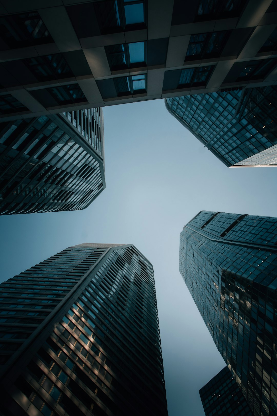 Modern skyscrapers reaching towards a clear blue sky